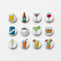 Set of 12 circular drink-themed refrigerator magnets with beer, wine, cocktails, and juice icons