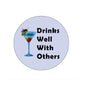 Round magnet with cocktail glass and bold Drinks Well With Others text