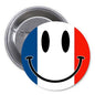 Round France flag smiley face pinback button with smiling face and blue-white-red stripes