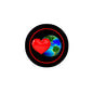 Round black pinback badge with red heart over colorful Earth globe