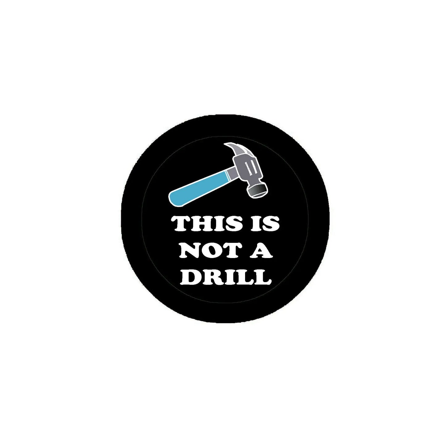Round black pinback button with wrench graphic and text “THIS IS NOT A DRILL”.