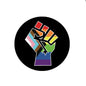 Circular pinback button with colorful raised hand graphic on black background