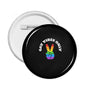 Round black LGBT pin badge with rainbow hand and text "GAY VIBES ONLY"