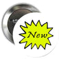 Round button brooch badge with pinback; lime yellow starburst graphic reading “New”