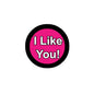 2.25-inch pinback button: black rim, pink center, 'I Like You!' text