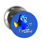 Blue cartoon fish pinback button with text 'Just Keep Swimming!'