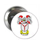 Round coat of arms pinback badge with crest shield and red ribbon accents