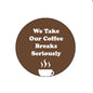 Round brown coffee breaks pinback badge with white text and steaming cup icon