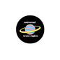 Round black pinback button: 'universal trans rights' with rainbow planet orbit graphic