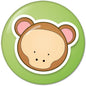 Round green pinback button with cartoon monkey face and white border
