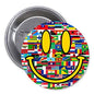 Smiley face pinback button with colorful country-flag pattern, yellow eyes and curved grin