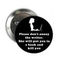 Round pinback badge, black face with writer silhouette and white quote text