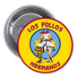 Round pinback button with yellow Los Pollos Hermanos logo and cartoon chicken couple
