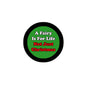2.25-inch pinback button, green center with “A Fairy Is For Life Not Just Christmas”