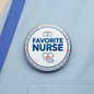 Round silver pinback button with Favorite Nurse text, stethoscope and red cross icon