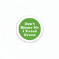 Round green pinback button with white text: "Don't Blame Me I Voted Green"