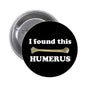 Black pinback button: 'I found this HUMERUS' and bone graphic