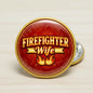 Round red firefighter wife pin with gold rim and flame graphic, pinback clasp