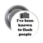 Round camera pinback with camera graphic and text: I've been known to flash people.