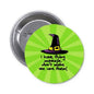 Round green pinback button with purple witch hat and slogan, 1.25-inch