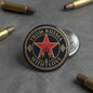 Round pinback button with gold border and red star, text 'FROM RUSSIA WITH LOVE'