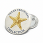 Round pinback button with golden starfish and “Ocean Treasures Collection” text