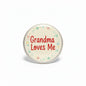 2.25-inch Grandma Loves Me pinback button, round with red text and floral border