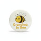 White pinback button with cartoon bee and 'Grandma to Bee' lettering