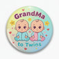 Round pinback button with smiling twin babies and 'Grandma to Twins' text.