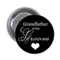 Black pinback button with white script "Grandfather of the Groom" and heart