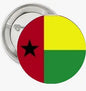 Guinea flag pinback button, round 2.25-inch with red yellow green vertical stripes and star.