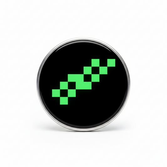 2.25-inch round glider pinback with black backing and green pixel emblem, silver border