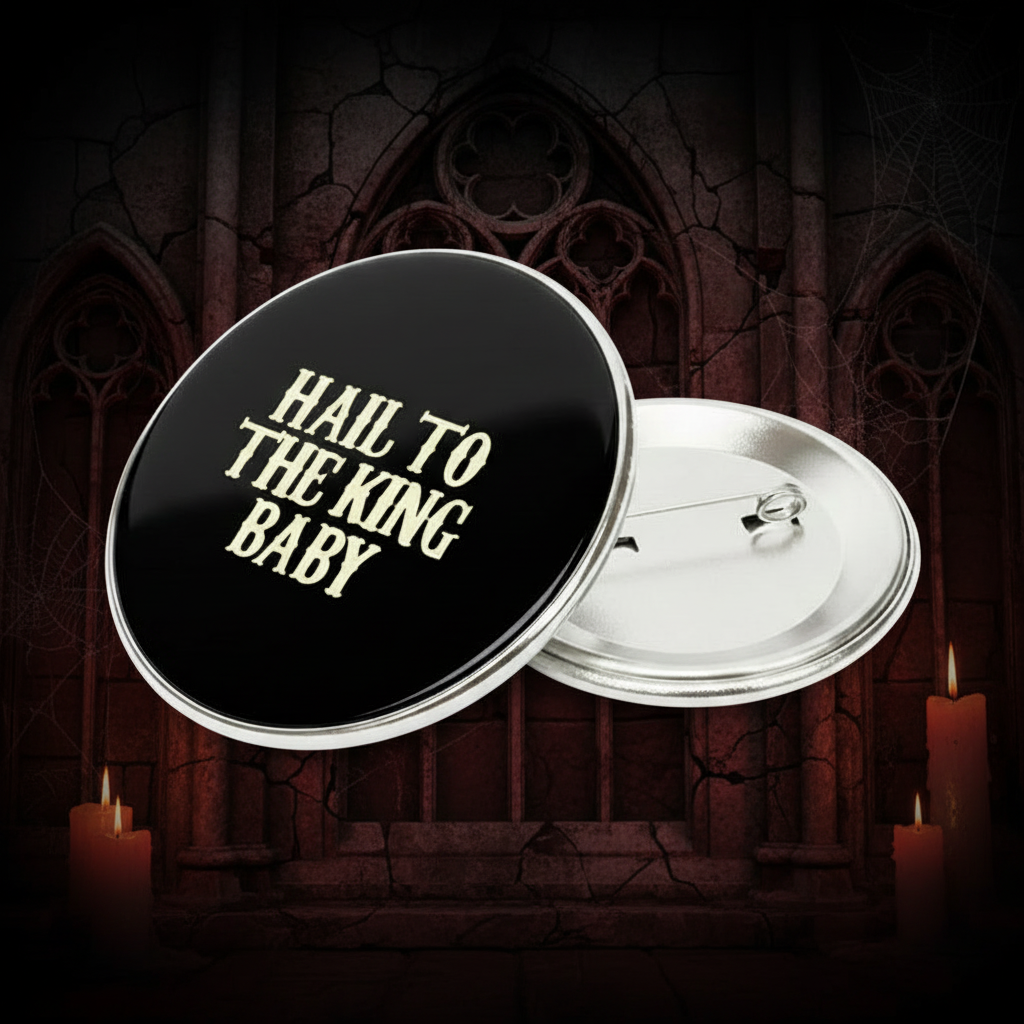2.25-inch black pinback button with gold “Hail to the King Baby” and hinged pin
