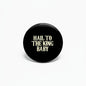 2.25-inch black pinback button with gold “Hail to the King Baby” text
