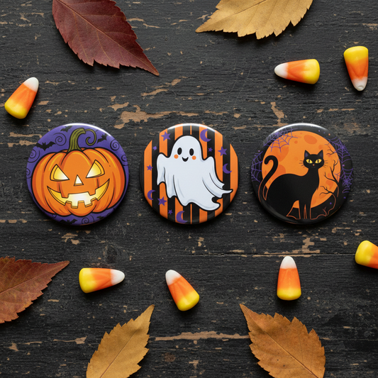 Set of three 2.25-inch Halloween pinback buttons with pumpkin, ghost, and black cat designs