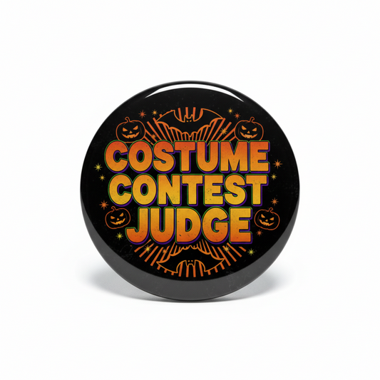 Round Halloween judge badge pin, black with orange “COSTUME CONTEST JUDGE” and pumpkins