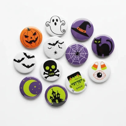 Collection of Halloween-themed buttons on a white background