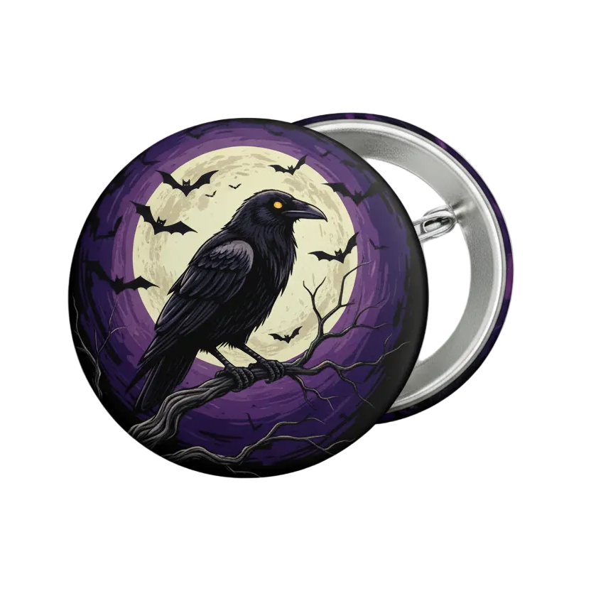 A round pin-back button badge featuring a black raven perched on a branch in front of a large cream-colored full moon, with silhouettes of bats and bare tree branches against a purple background. The back of the badge is metallic silver.
