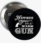 Round black pinback button with white text graphic and silver metal back
