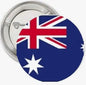 Blue circular flag pinback with union jack and white stars, metal back