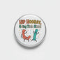 Round pinback button with cartoon cat, dinosaur, and bold 'HIP HOORAY' text