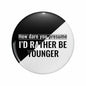 2.25-inch round pinback button with black and white halves and bold slogan text