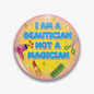 2.25-inch pinback badge with slogan 'Beautician Not a Magician' and beauty icons