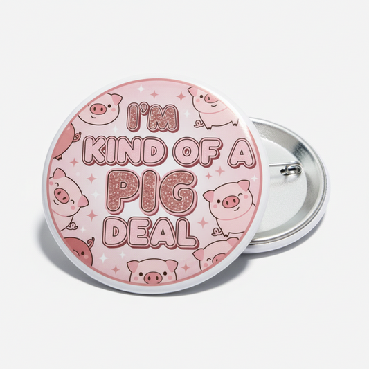 Round pinback button with pink pig design and text, silver metal backing