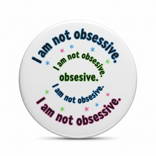 Round pinback button featuring multicolor text pattern with “I am not obsessive”
