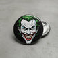 2.25-inch Joker pinback button with grinning clown face, black background