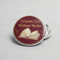Maroon books quote pinback button with open book graphic, round 2.25-inch size