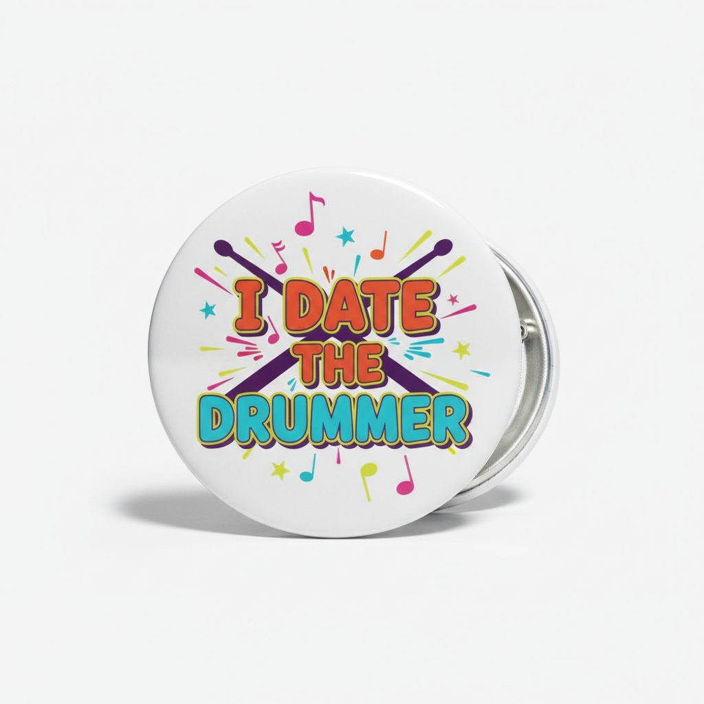 Button badge with 'I DATE THE DRUMMER' text and musical notes on a white background