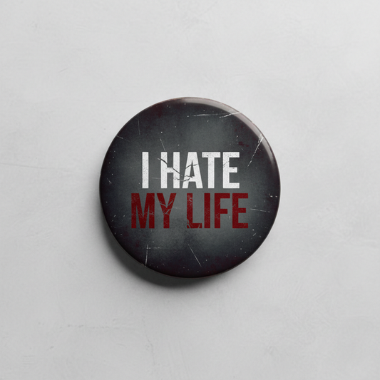 Button badge with 'I HATE MY LIFE' text on a gray background