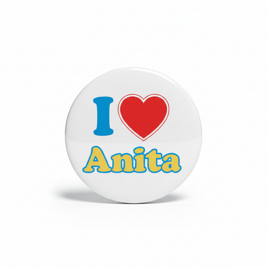 Pinback button, round white design with blue “I”, yellow “Anita”, and red heart